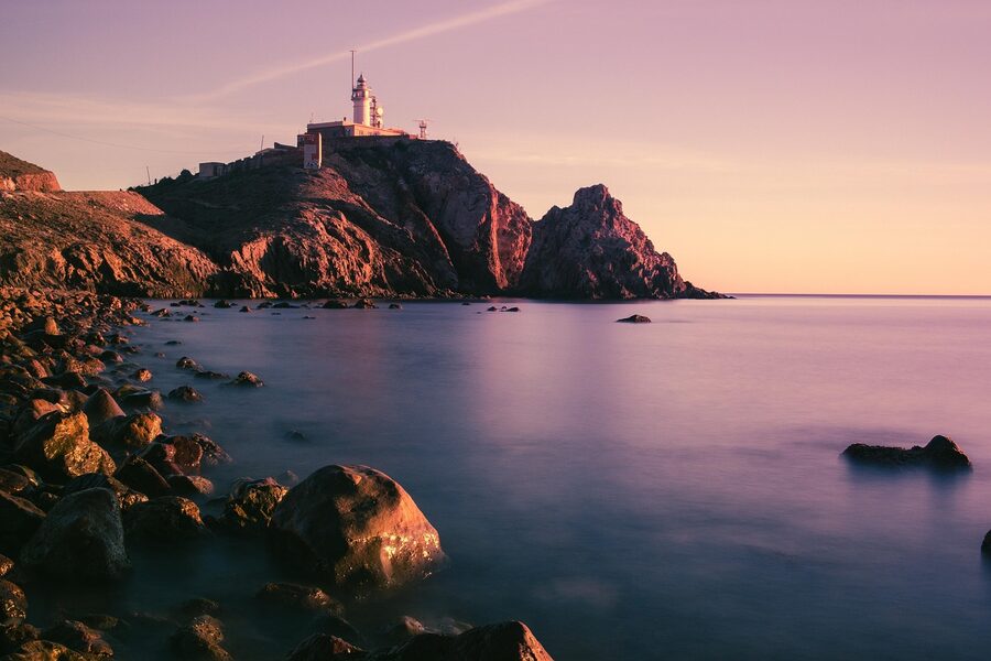 Sunset over Cabo de Gata lighthouse and coastline