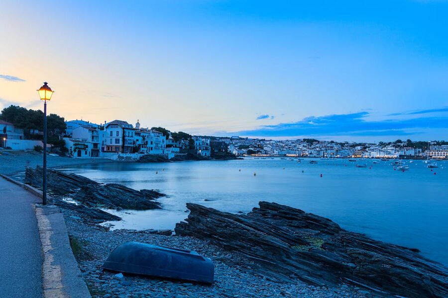 Evening light over the whitewashed houses along the seaside in Cadaques, Costa Brava