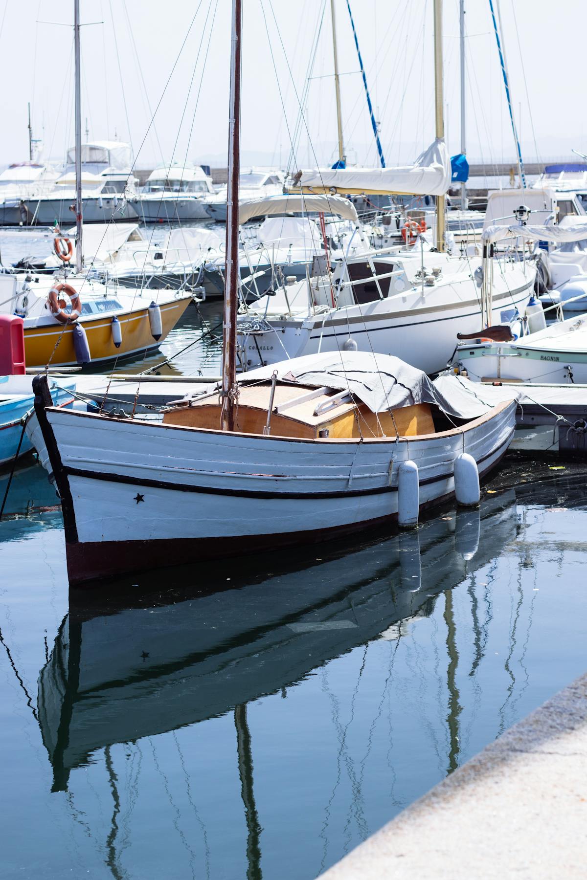 Sailboats moored at the Cagliari Marina in Sardegna Italy on a bright sunny day