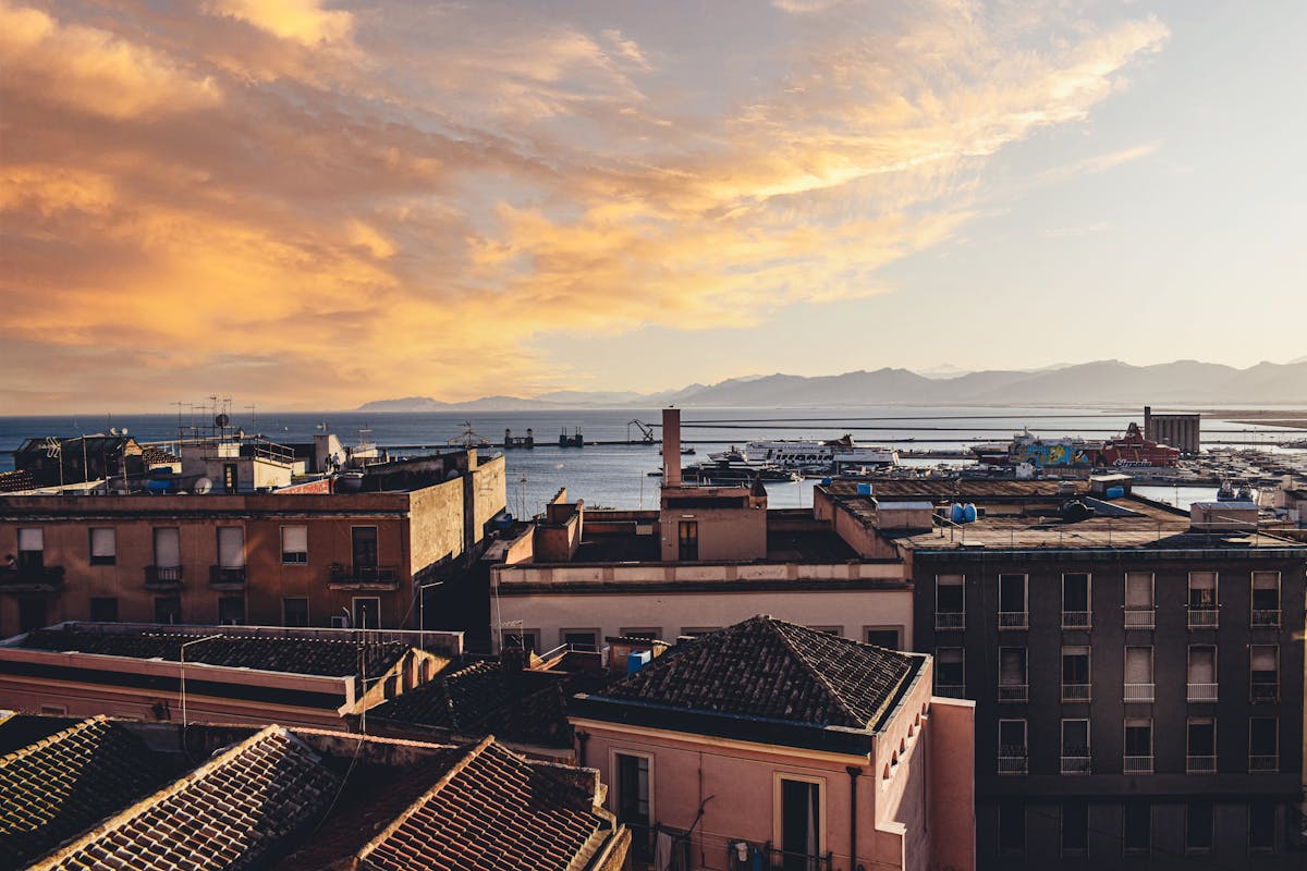 Golden sunset over Cagliari Sardinia with the Mediterranean Sea and city skyline