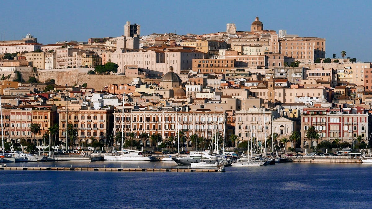 The colourful waterfront of Cagliari Sardinia with historic buildings along the harbour