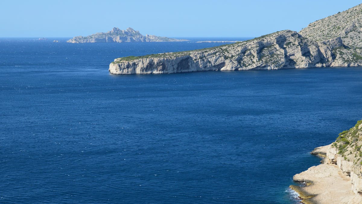 Calanques cliffs rising above the blue Mediterranean sea