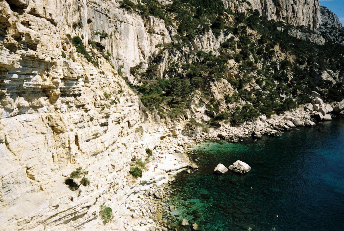Rugged limestone cliffs and clear water at Calanques National Park