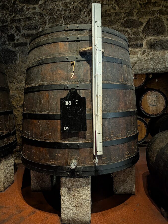Inside the Cálem cellar in Porto with wooden barrels
