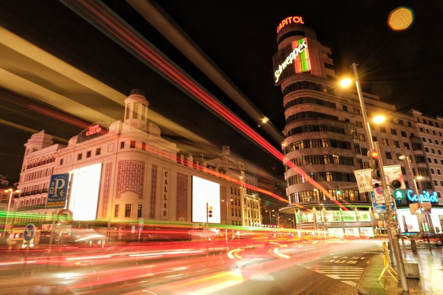 Long exposure of Callao Square in Madrid showing nightlife activity