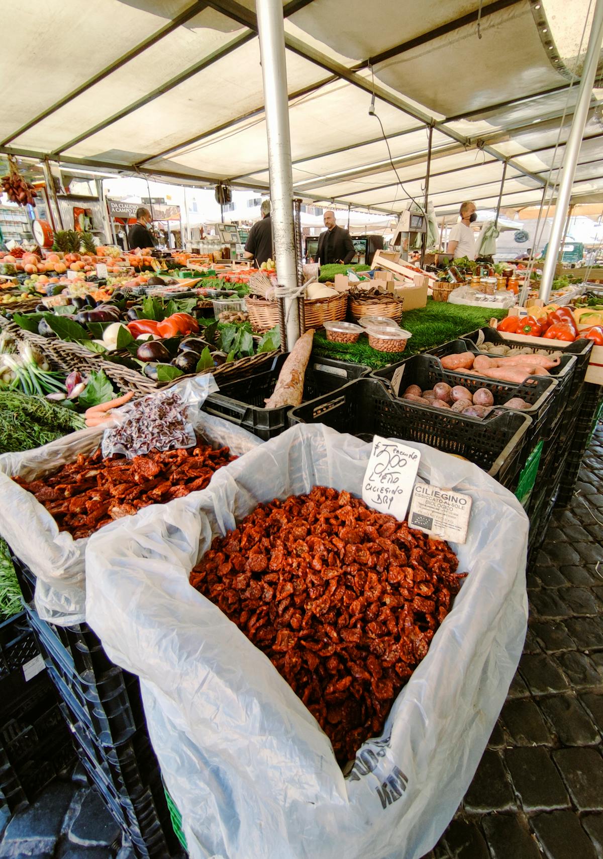 Colorful produce stalls at Campo de Fiori market in Rome