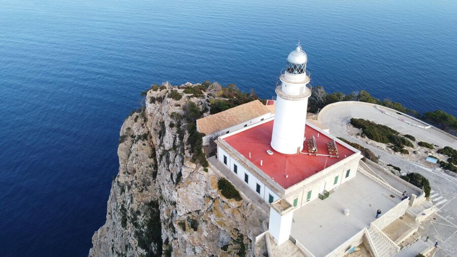 Cap de Formentor lighthouse perched on Mallorca dramatic cliff edge