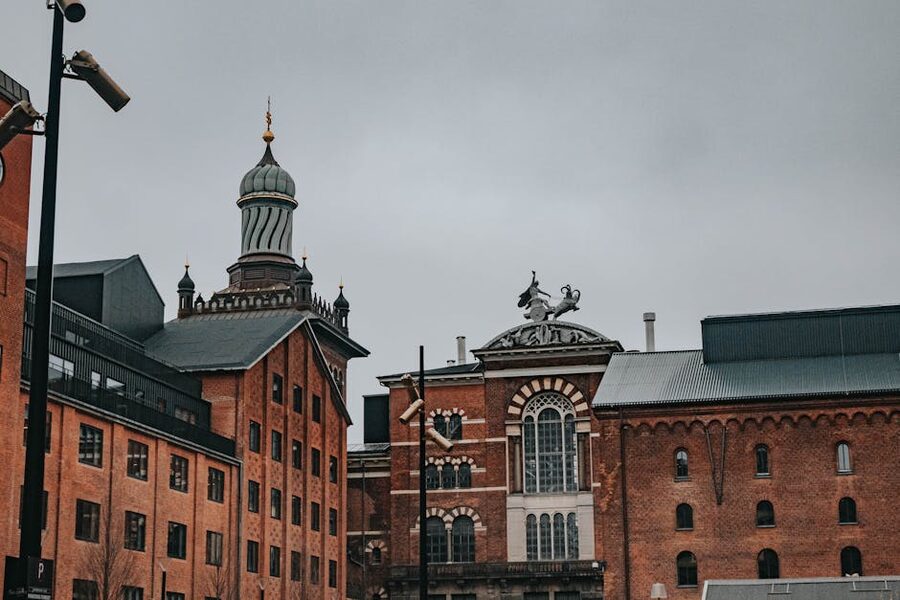 Historic Carlsberg Brewery buildings in Copenhagen on a cloudy day