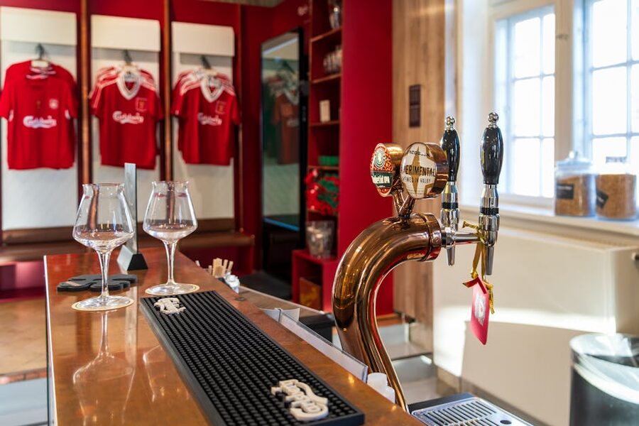 Cozy Carlsberg brewery bar with vintage football jerseys