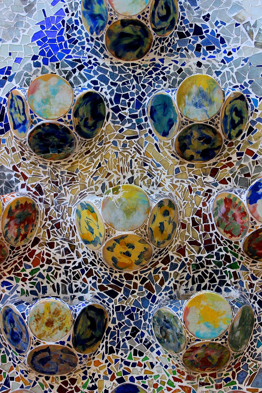 Detailed view of mosaic tile work at Casa Batllo showing Gaudi trencadis technique with broken ceramic pieces
