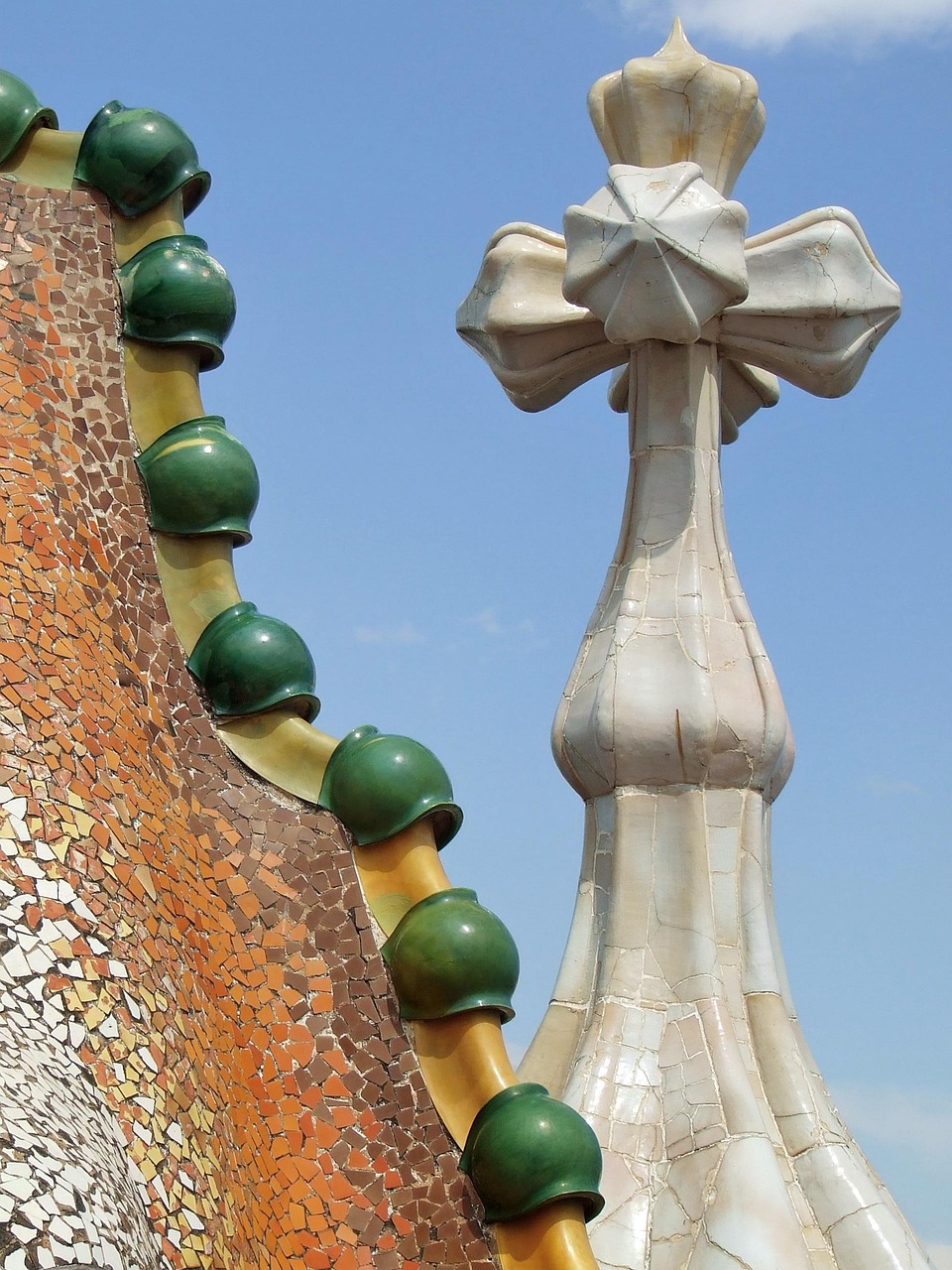 The rooftop of Casa Batllo showing the dragon-spine ceramic tiles and colourful chimney pots designed by Gaudi