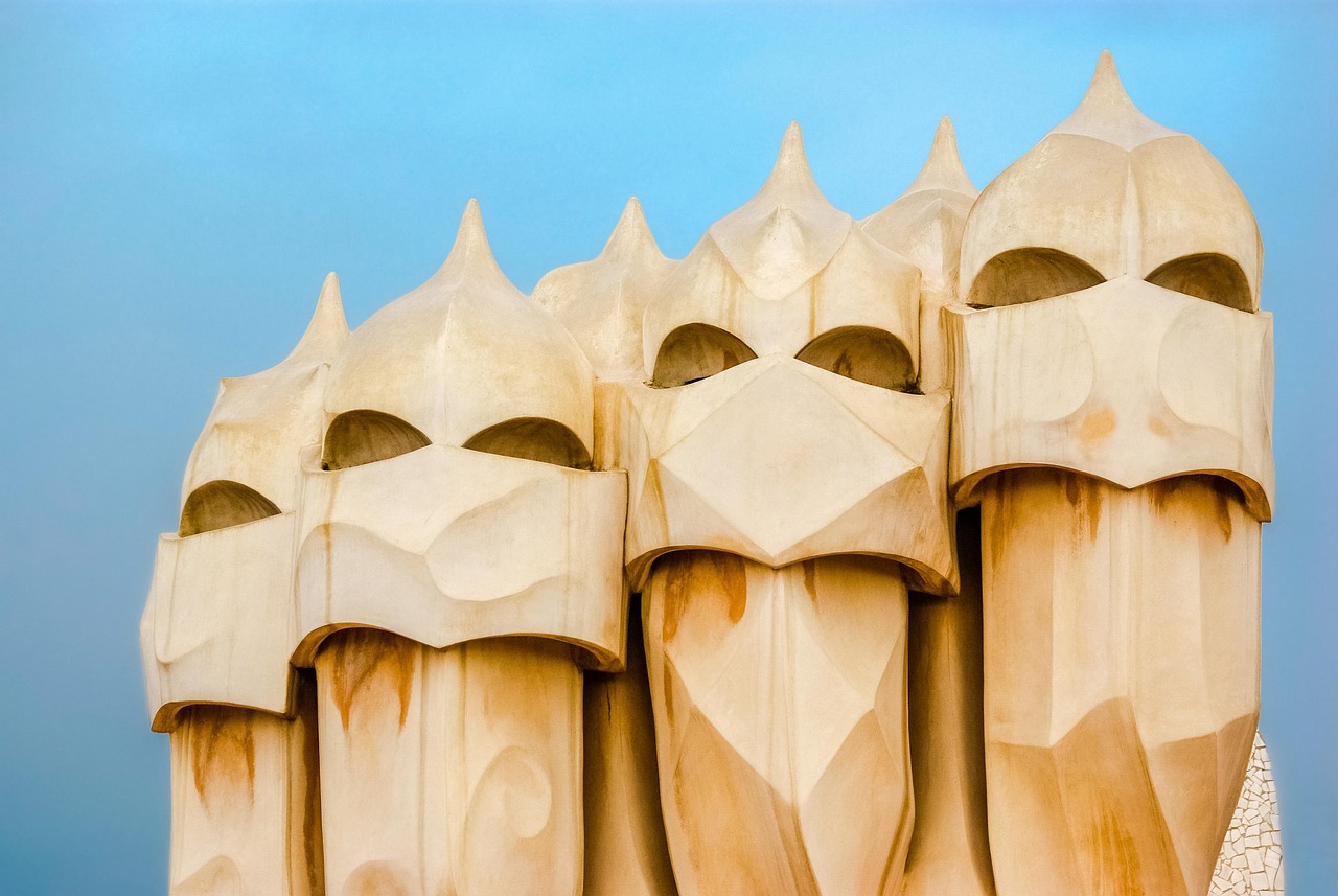 Wide angle view of Casa Mila La Pedrera building showing the full scale of Gaudi organic stone facade