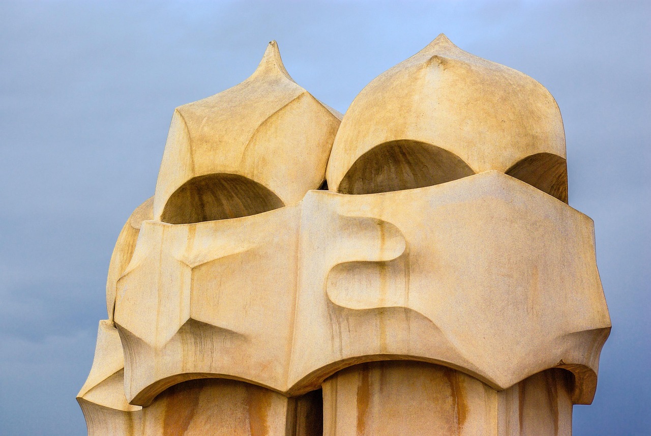 The interior courtyard of Casa Mila La Pedrera showing the curved walls and balconies rising upward