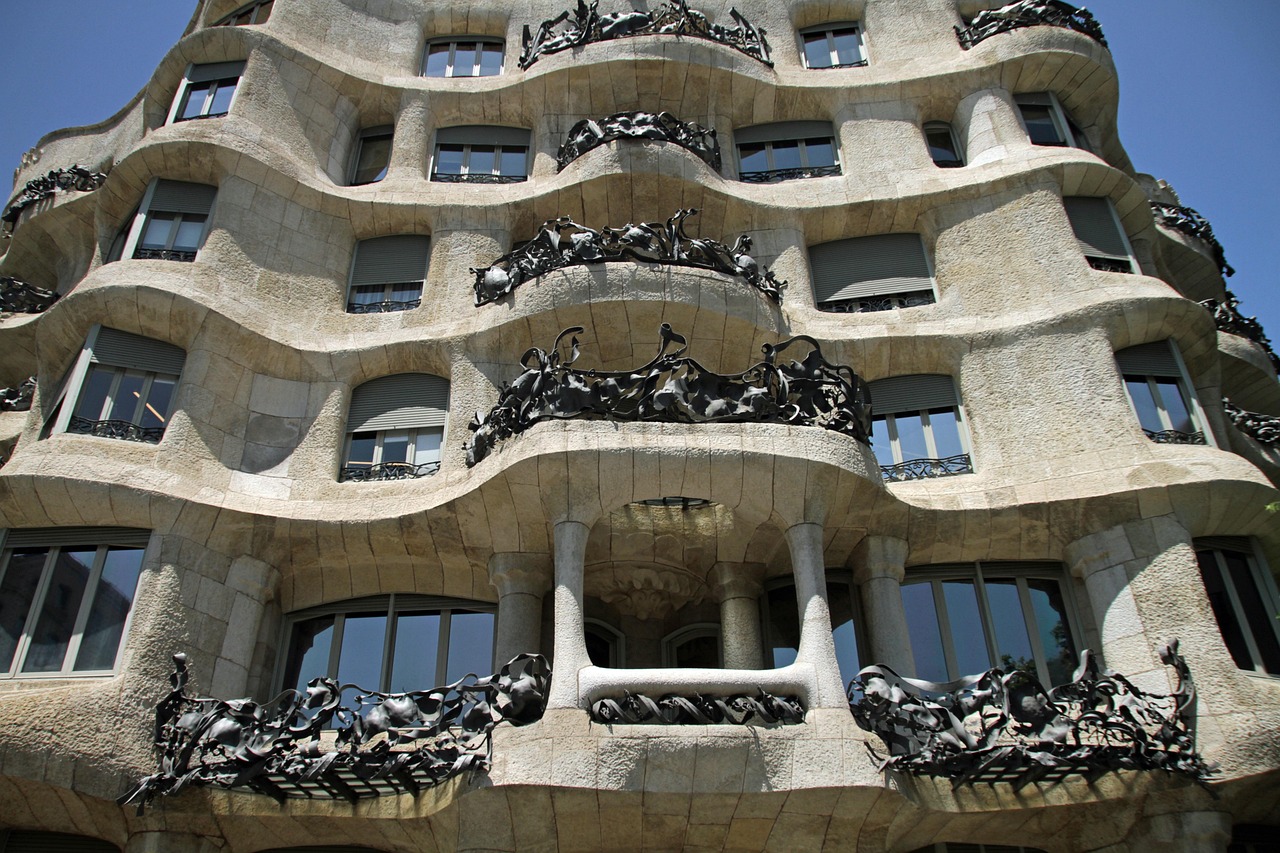 Casa Mila La Pedrera building showing the full facade with its organic stone curves and iron balconies