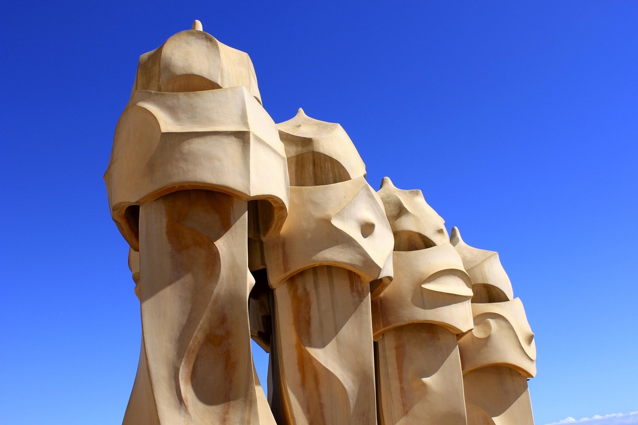 Casa Mila La Pedrera exterior viewed from street level showing visitors and the distinctive facade