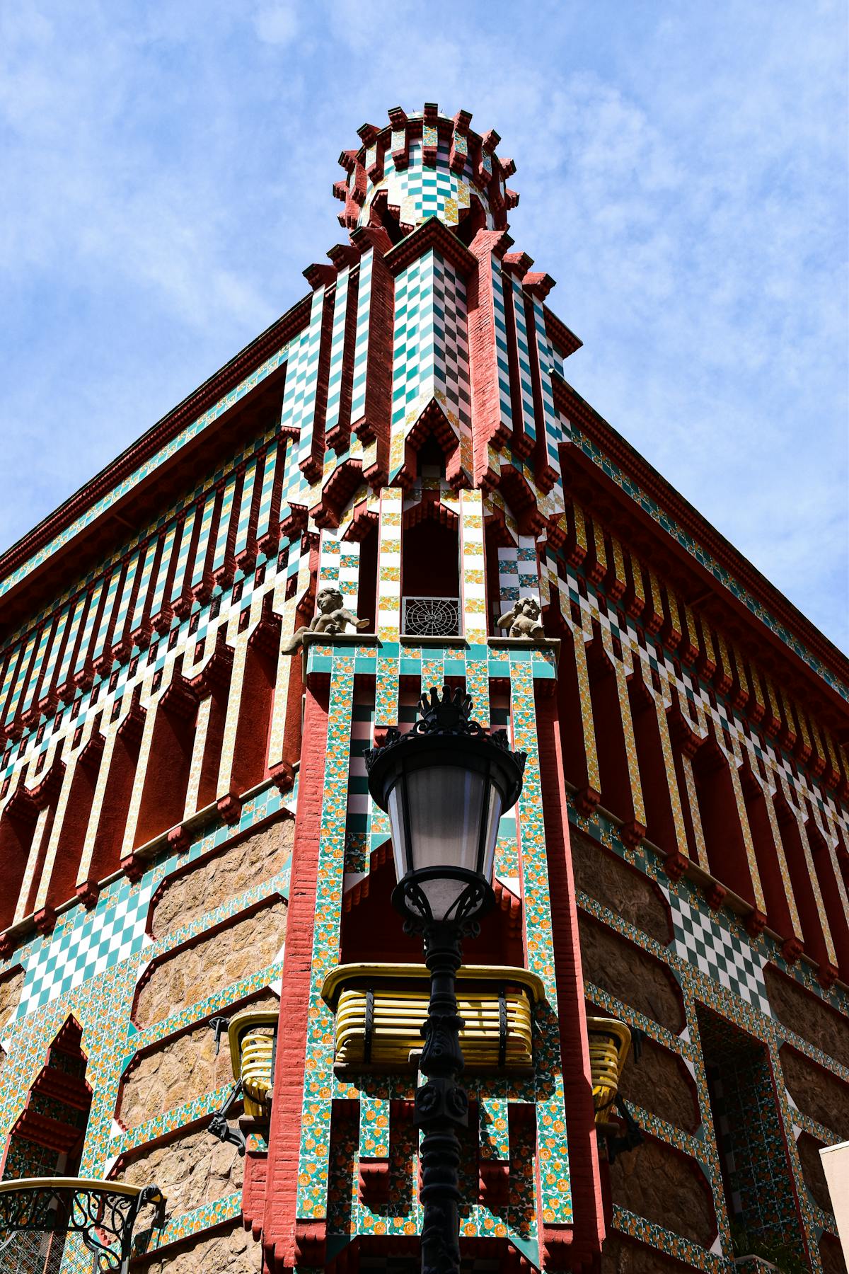Ornate facade of Casa Vicens displaying geometric tile patterns and floral motifs designed by Gaudi
