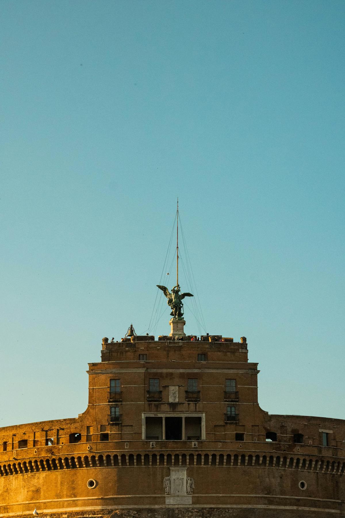 Castel Sant'Angelo fortress rising against a clear blue Roman sky