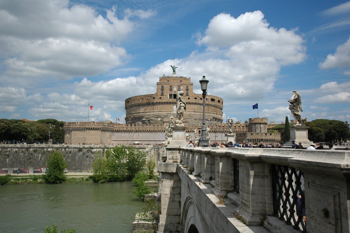 Angel statues lining Ponte Sant'Angelo with the castle in the background
