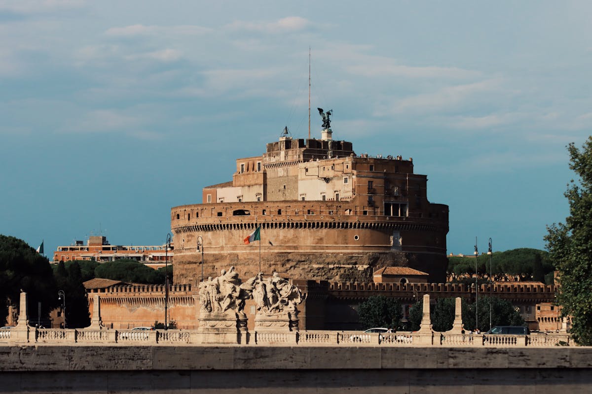 Castel Sant'Angelo with Bernini angel statues on the bridge during summer