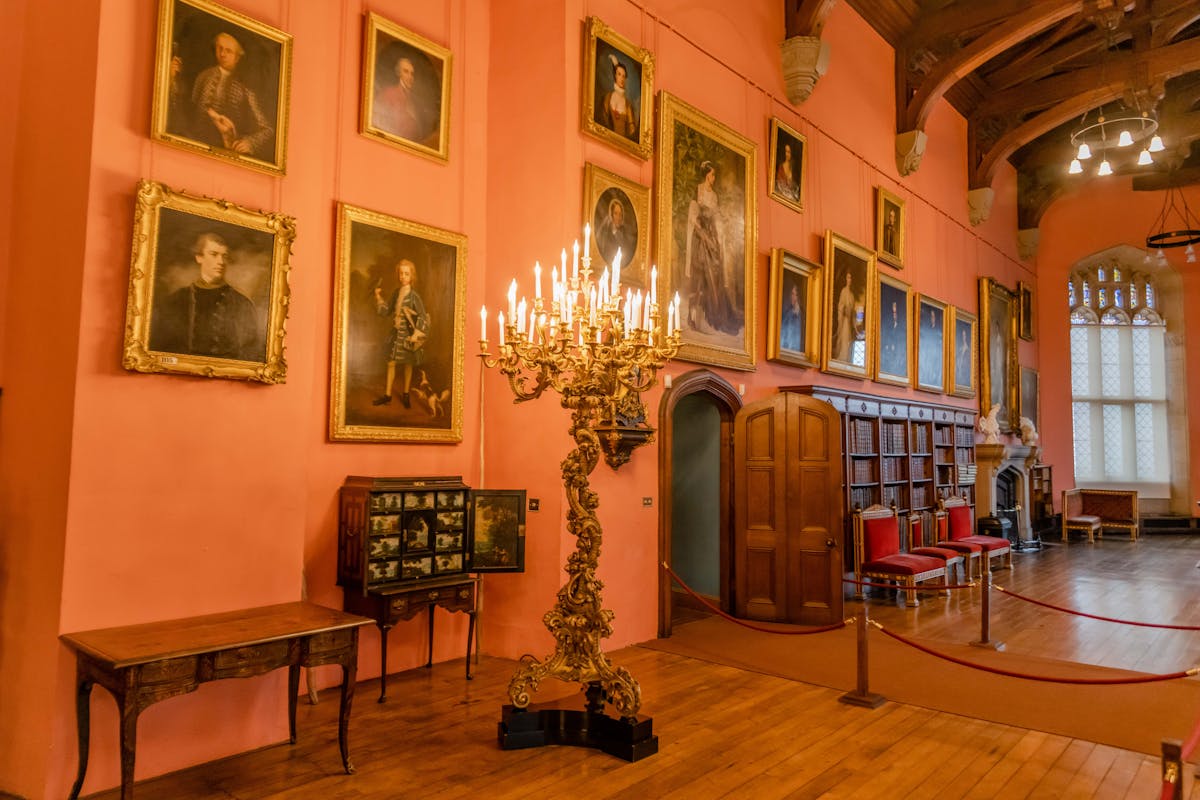 Ornate interior of a stately English room with antique furniture and paintings