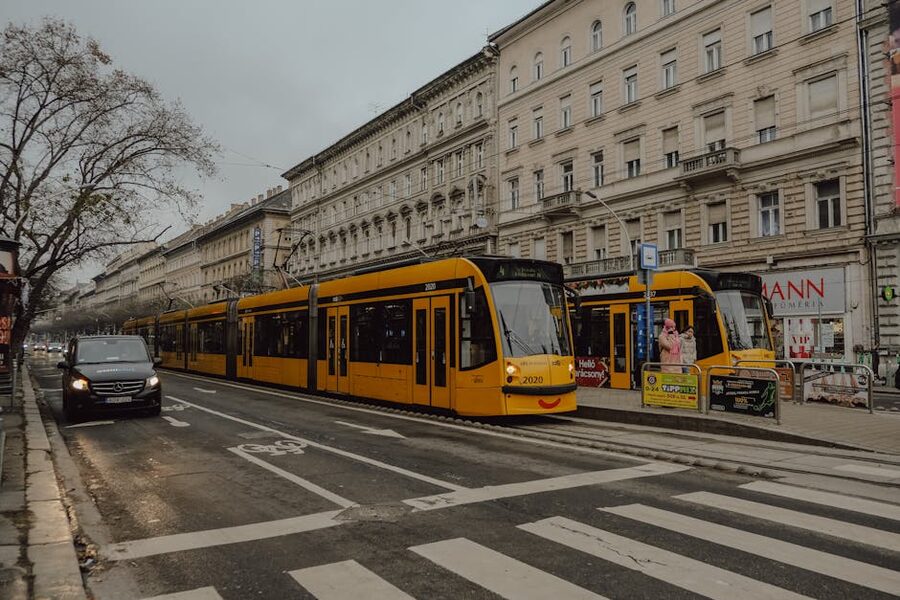 Yellow tram on Budapest street near Cat Museum