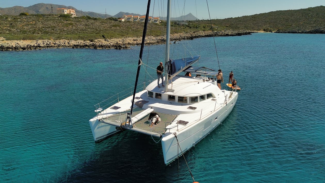 Aerial view of catamaran with passengers in Greek waters