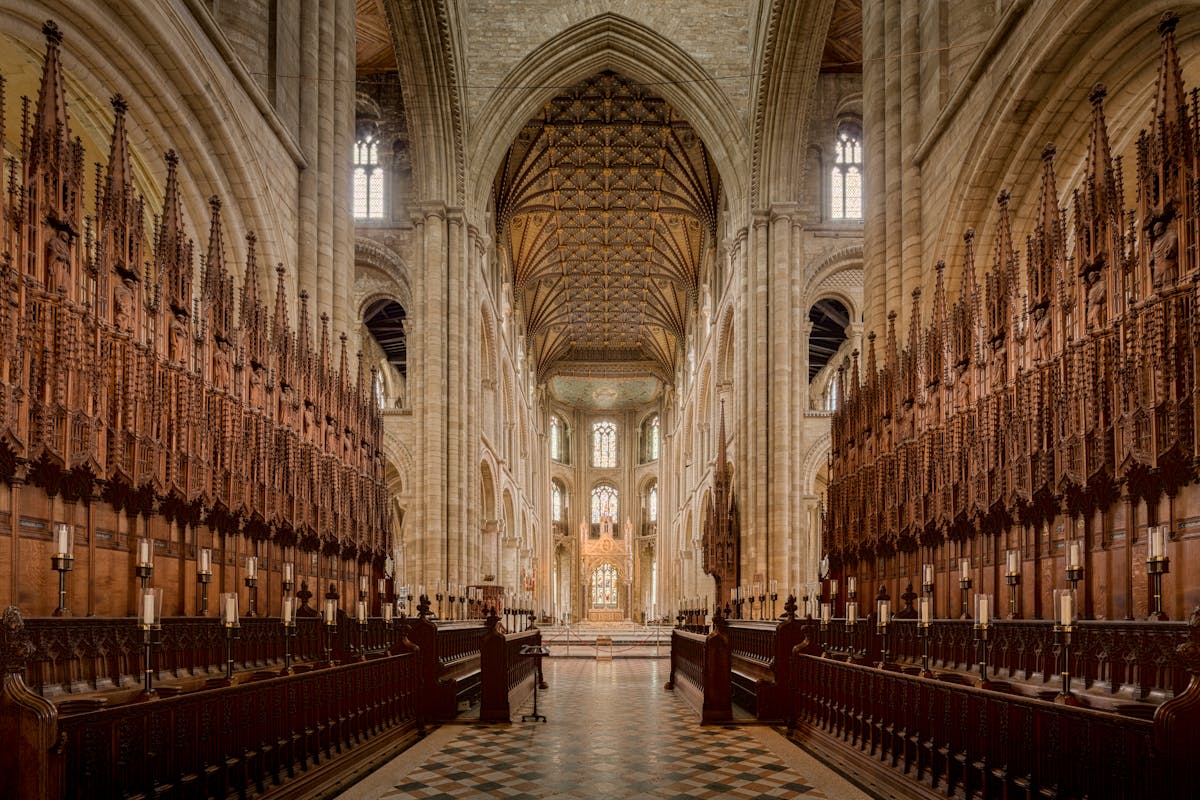 Interior of a Gothic cathedral showing soaring stone arches and columns