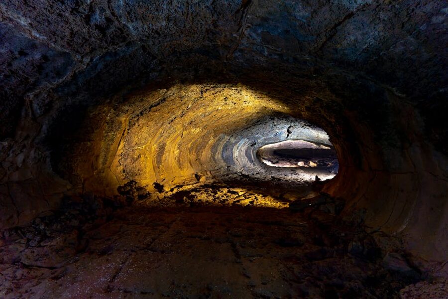 Cave tunnel illuminated with warm tones