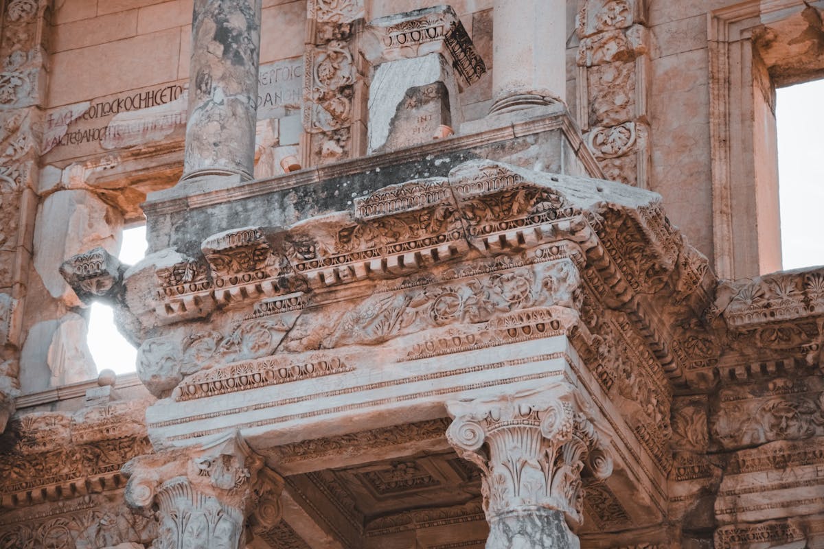 Close-up of ornate marble columns and carved statues on the Library of Celsus facade at Ephesus