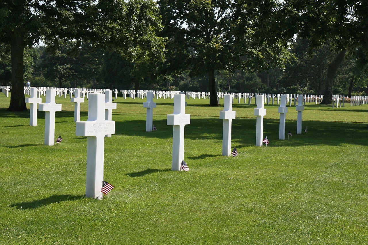 Close view of white marble crosses at the American Cemetery