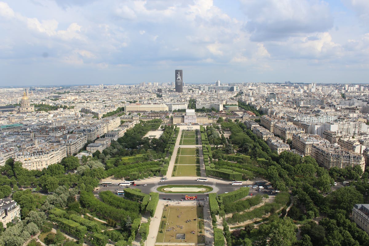 Aerial shot of the Champ de Mars gardens leading to the Eiffel Tower seen from Montparnasse Tower