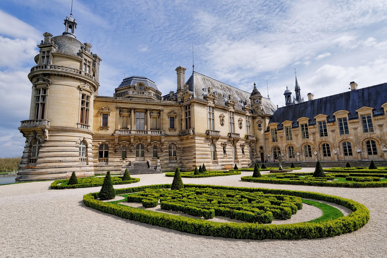 Chateau de Chantilly castle with surrounding grounds and moat