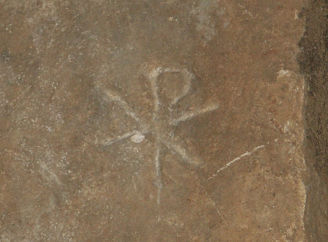 Ancient Chi Rho symbol carved in stone tablet from the Catacombs of San Callisto in Rome