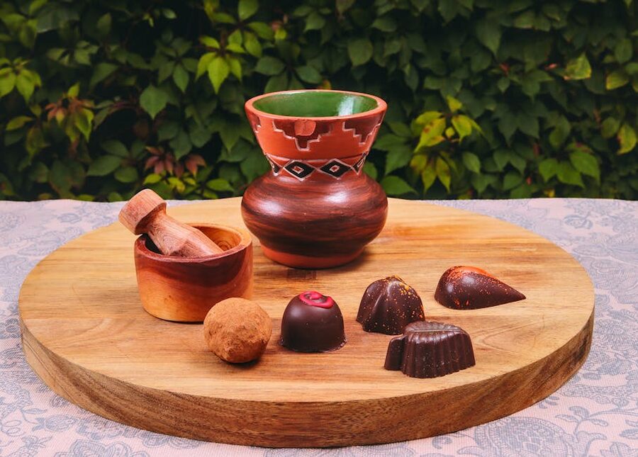 Chocolate pralines on wooden board display