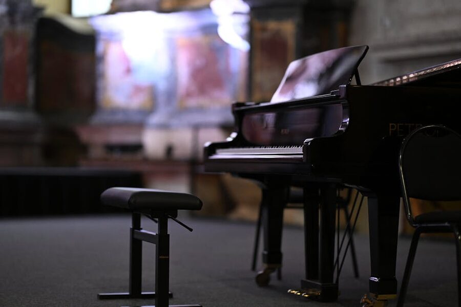 Grand piano in an ornate concert hall