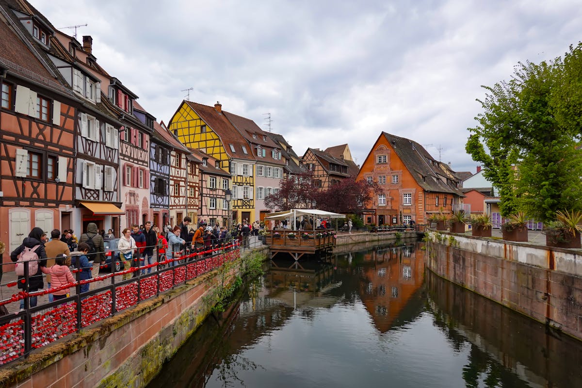 Colorful half-timbered buildings along canal in Colmar Little Venice