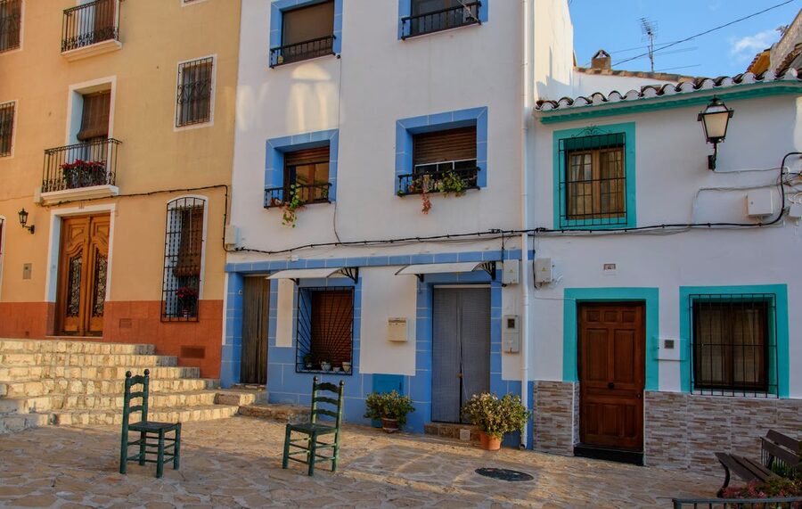Bright colorful facades of village houses in Finestrat Spain