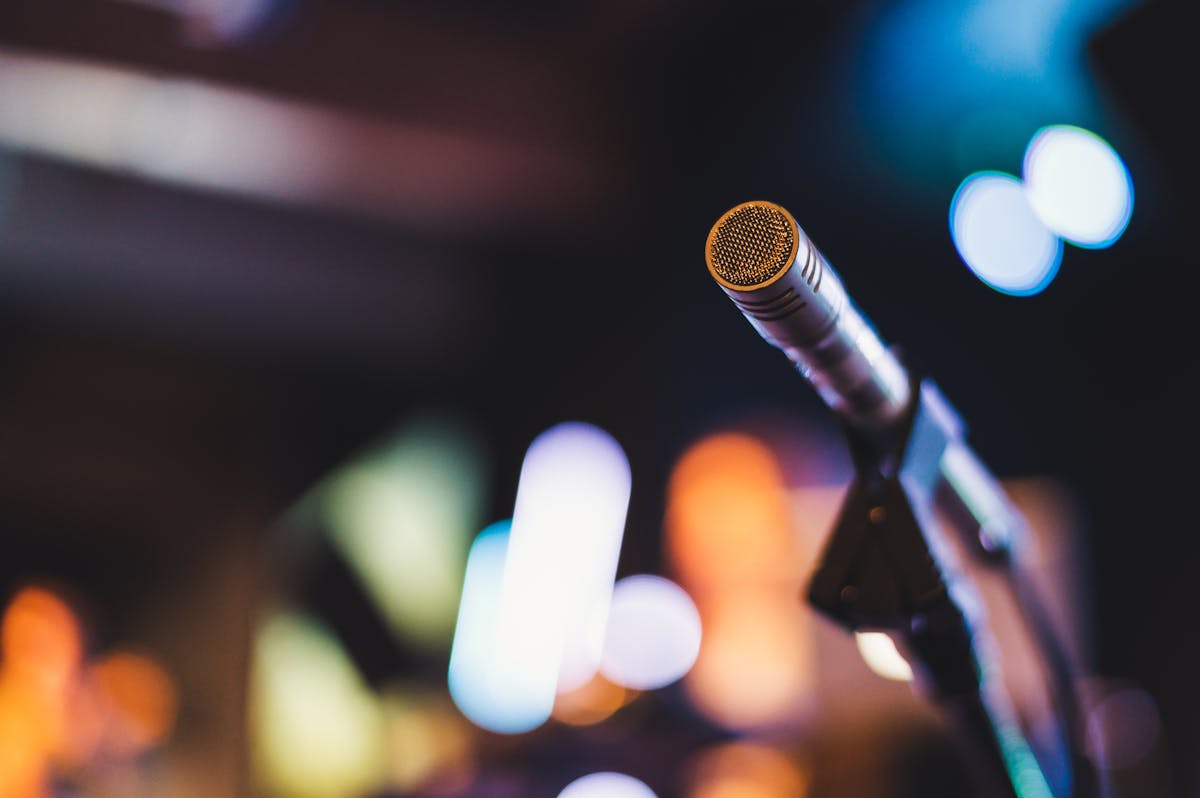 Microphone on stage with colorful background