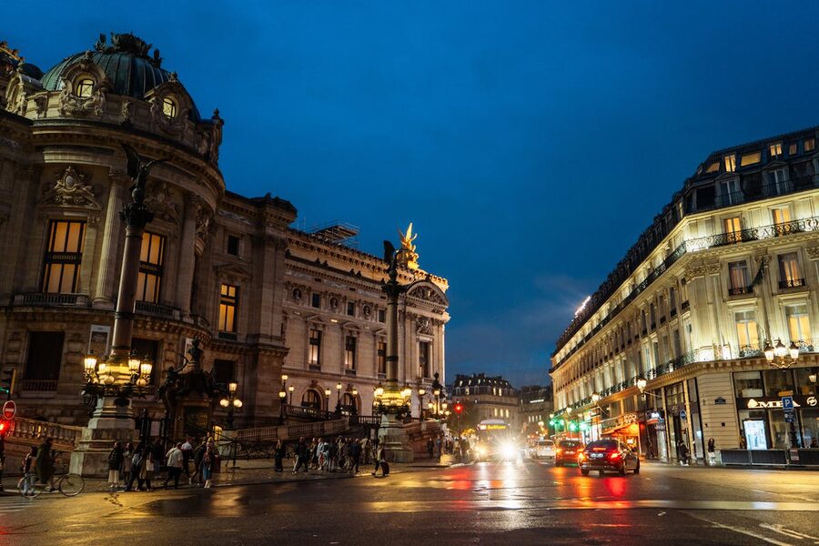 Evening view of the Opera Garnier in Paris with city lights