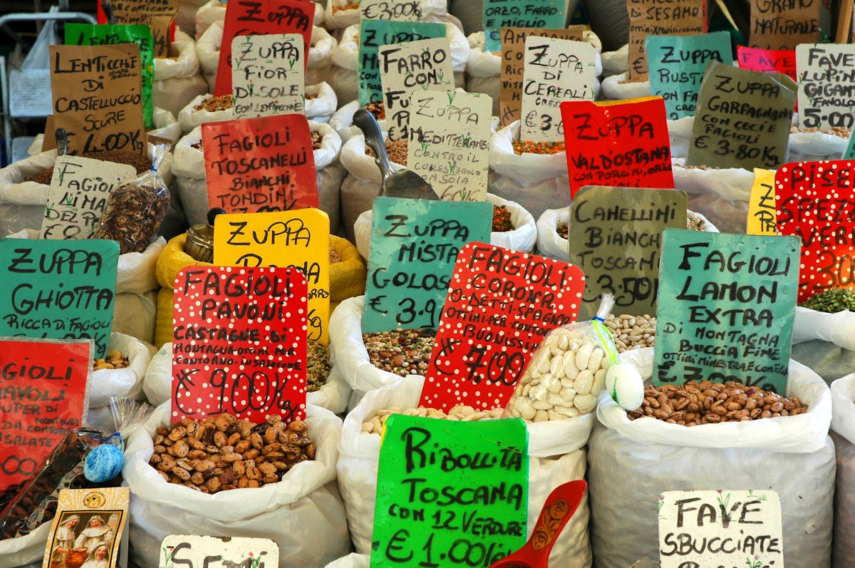 Assorted beans and lentils displayed at a Roman food market