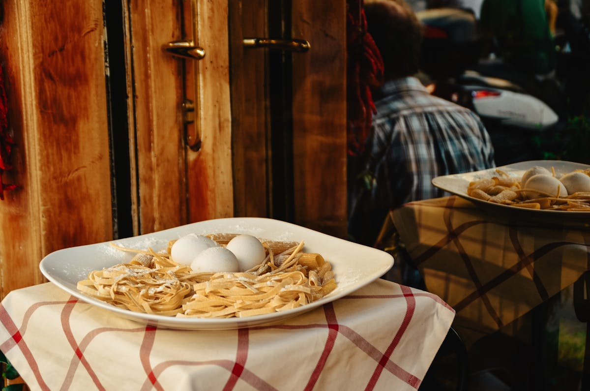Fresh pasta and eggs displayed outside a restaurant in Rome
