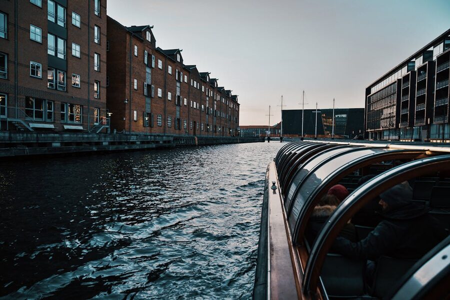 View of Copenhagen canal waterways and historic architecture from a canal boat