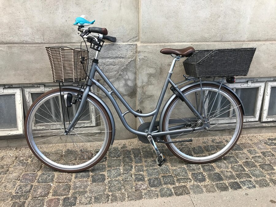Bicycle with basket on a Copenhagen cobblestone street