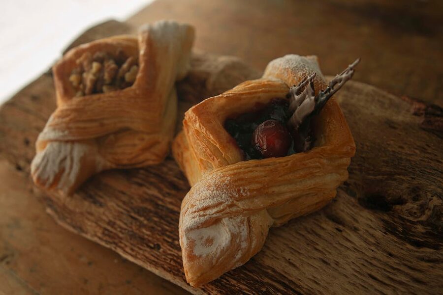 Artisan Danish pastries with fresh fruit on display