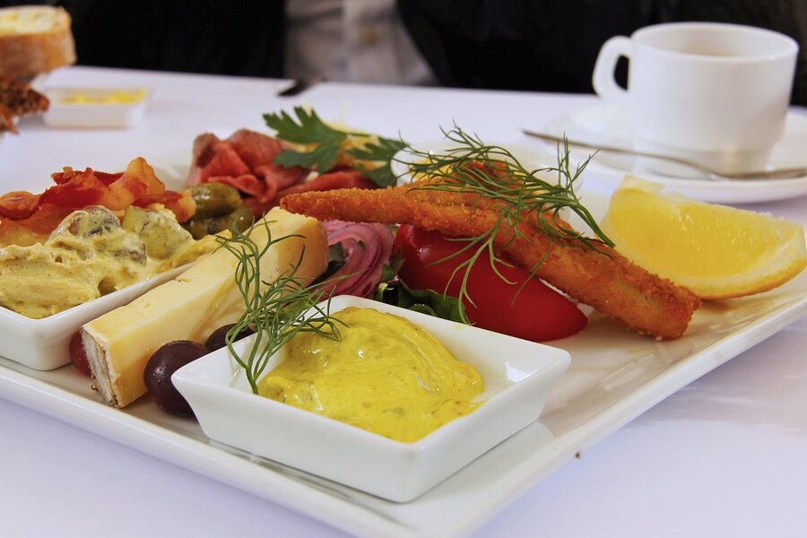 Copenhagen cafe lunch setup with herrings, cheese, and bread