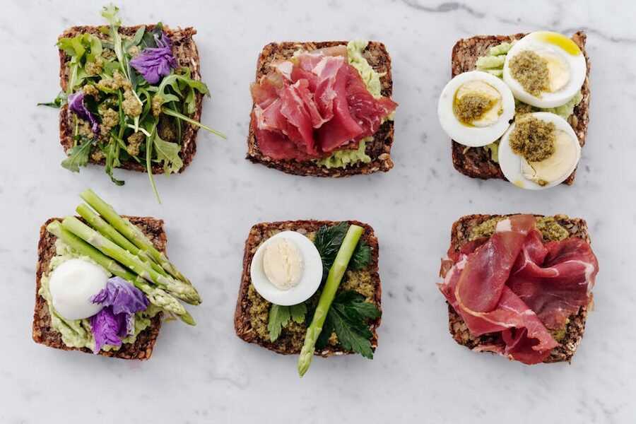 Six smorrebrod open-faced sandwiches arranged for tasting