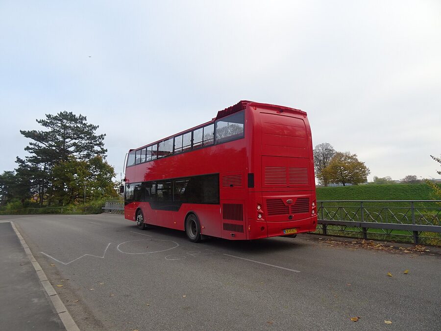 Red Sightseeing bus parked on Langelinie near Little Mermaid Copenhagen