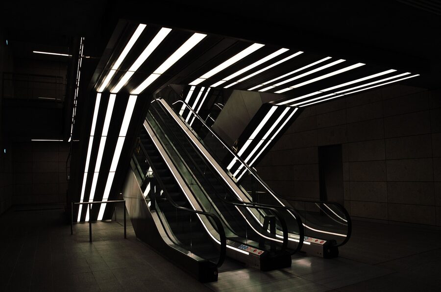 Modern Copenhagen Metro underground station with illuminated escalator