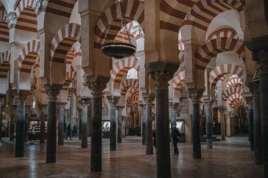 The famous red and white double arches inside the Mosque-Cathedral of Cordoba