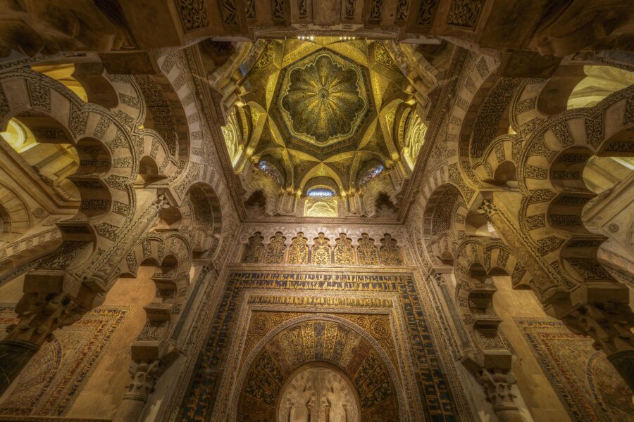 Ornate decorated arches and detailed Moorish decoration inside the Cordoba Mezquita